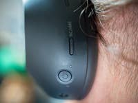 Close-up of a Sony WH-1000XM6 headphone showing control buttons on the side.