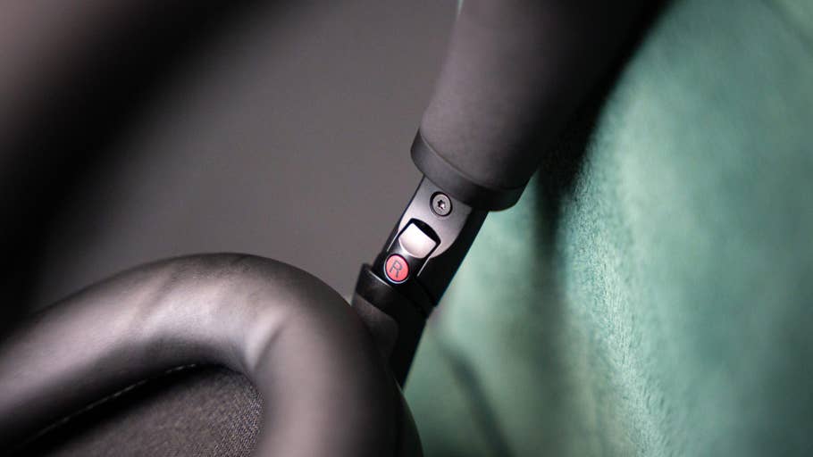 Close-up of the controls and ear cushion of the Sony WH-1000XM6 headphones.