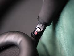 Close-up of the Sony WH-1000XM6 headphone controls and ear cup.