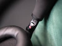 Close-up of the Sony WH-1000XM6 headphone controls and ear cup.