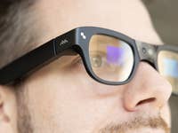 Close-up of a person wearing TCL RayNeo X3 Pro smart glasses.