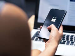 Smartphone displaying a lock screen with a padlock icon