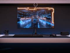 Promotional Intel NUC 11 image next to a gaming monitor