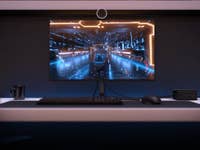 Promotional Intel NUC 11 image next to a gaming monitor