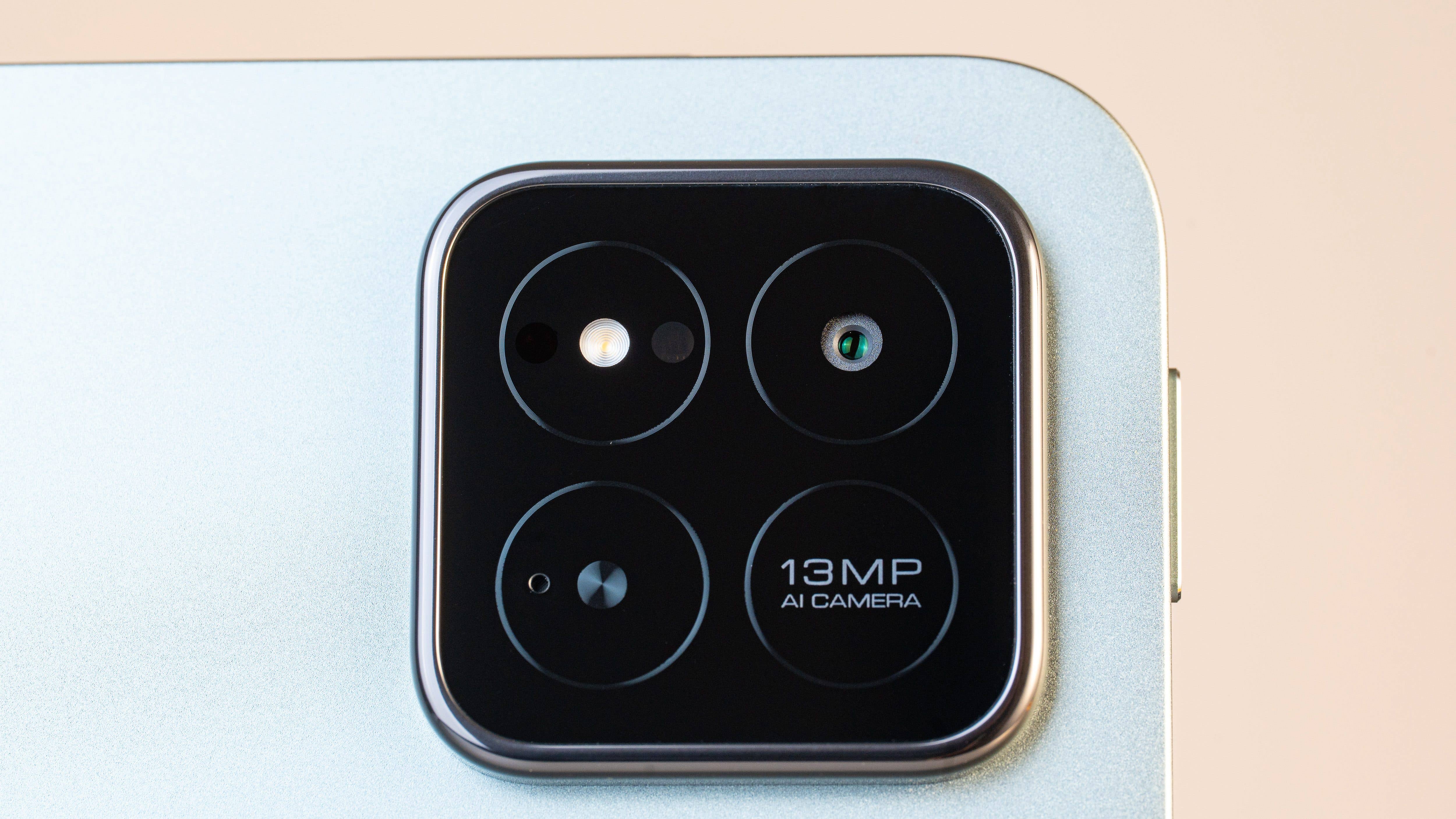 Close-up of Xiaomi Pad 7 camera module with two lenses and a 13MP AI camera label. Close-up of Xiaomi Pad 7 camera module with two lenses and a 13MP AI camera label.
