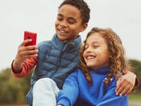 Two children use the XploraOne.