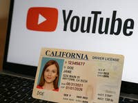 A US driver's license on an open laptop.